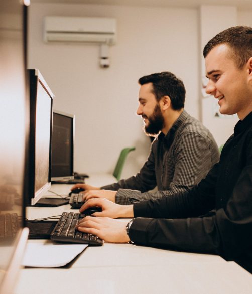 Young male web designers working on a computer